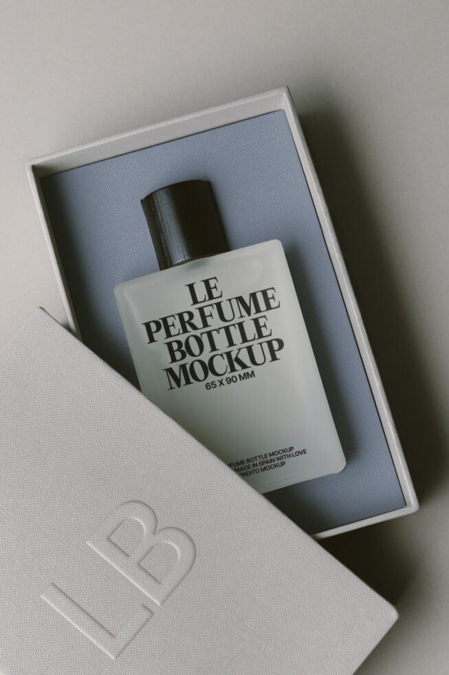 Perfume bottle mockup in luxury white box with blue tissue insert