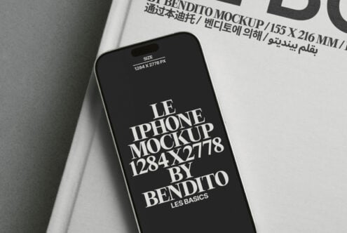 White book page with iPhone mockup displaying dark screen