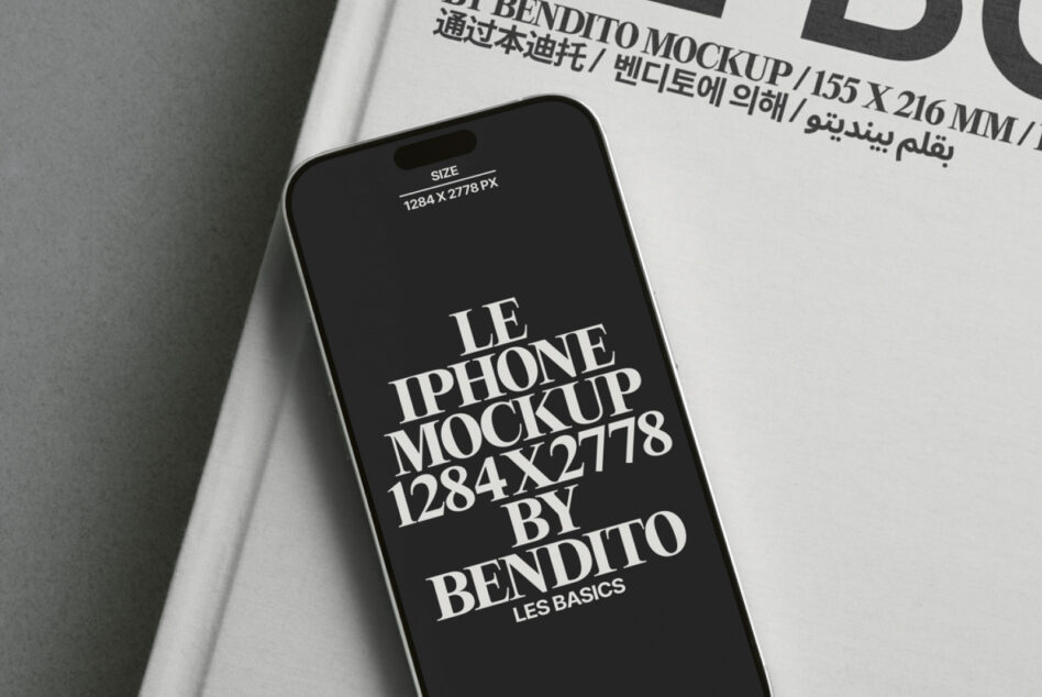 White book page with iPhone mockup displaying dark screen