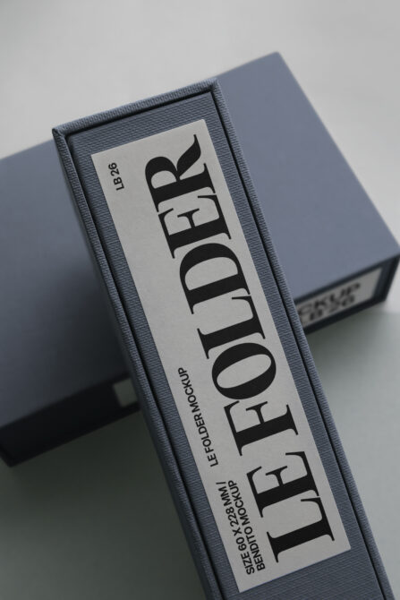 Gray box with vertical label mockup displaying Les Autres branding centered