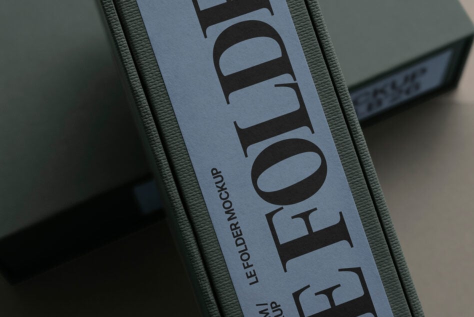 Close up of label mockup on folder showing Les Autre text in bold serif