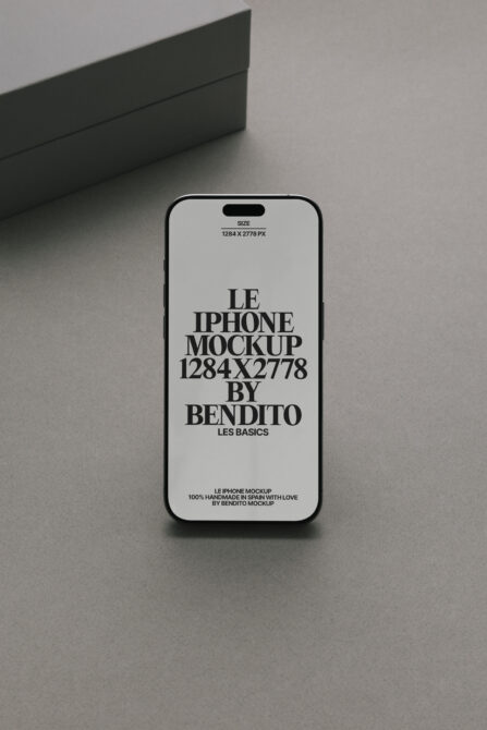 White iPhone mockup on gray surface with black box in background