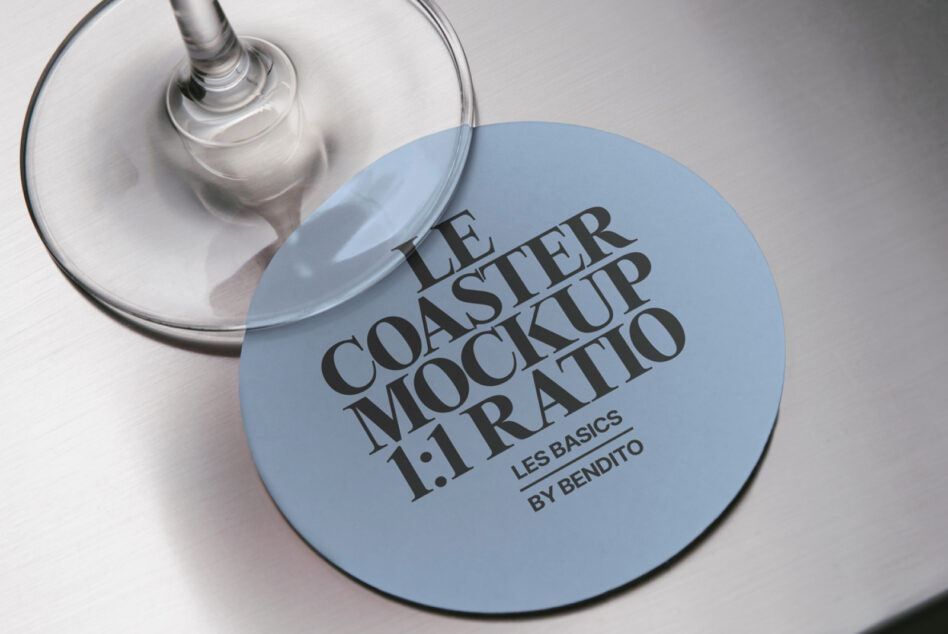 Blue coaster mockup with black serif typography, wine glass overhead shot