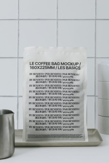 White coffee pouch mockup displayed against subway tile background