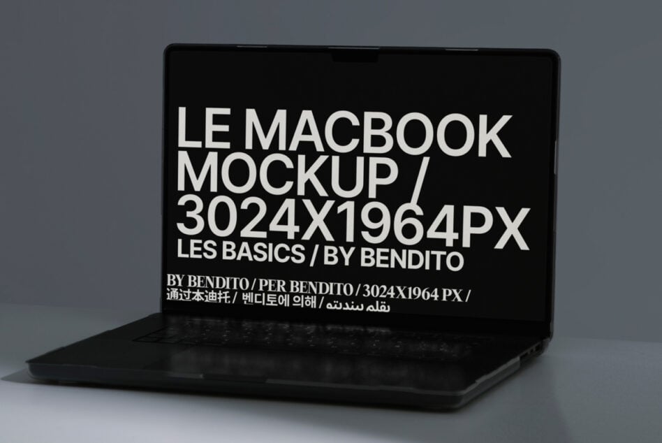 Black laptop mockup with white multilingual text filling entire screen display