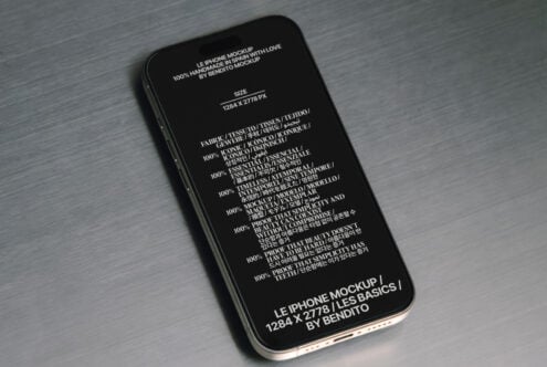 iPhone mockup with black screen displaying multilingual content on grey textured background