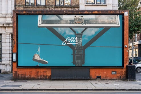 Street billboard mockup with turquoise background showing hanging shoe graphic