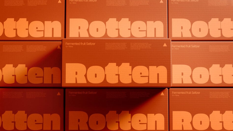 Stacked cardboard boxes with bold orange rotten text, product packaging mockup