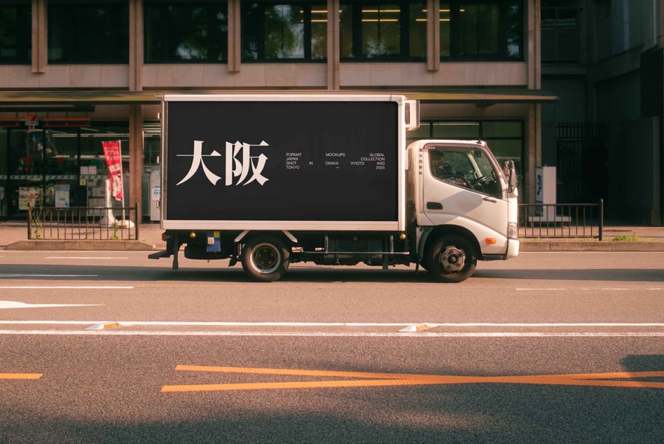 Delivery truck side panel with light background, Japanese characters, urban street