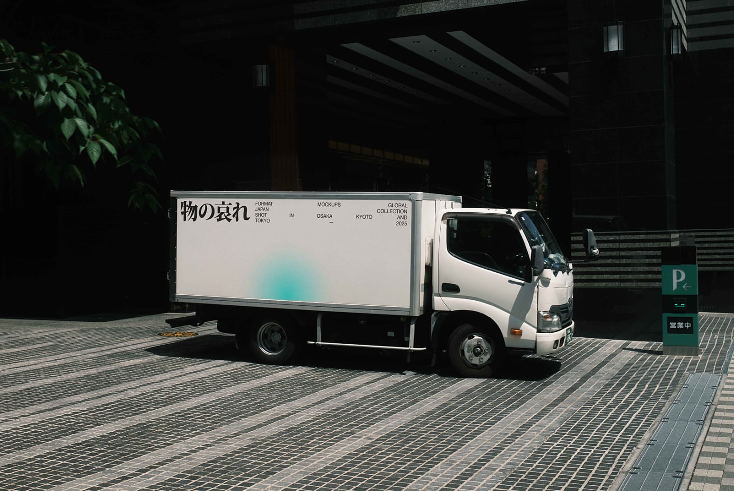 White delivery truck with light blue gradient on billboard side