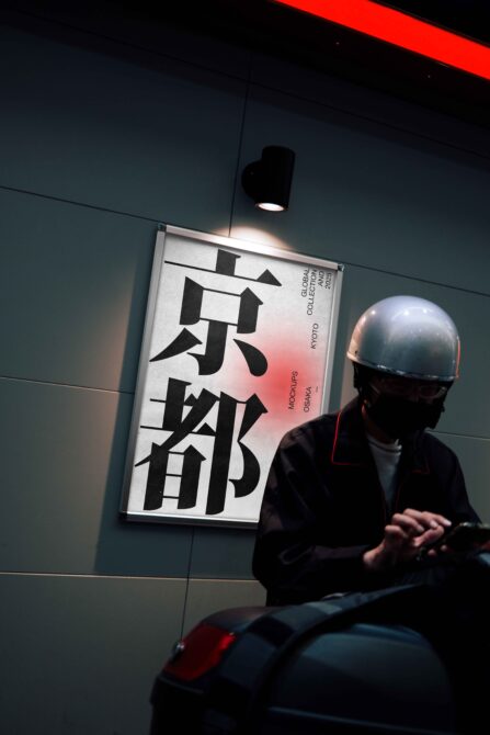 Woman in helmet viewing wall-mounted poster with bold Japanese characters, red gradient background