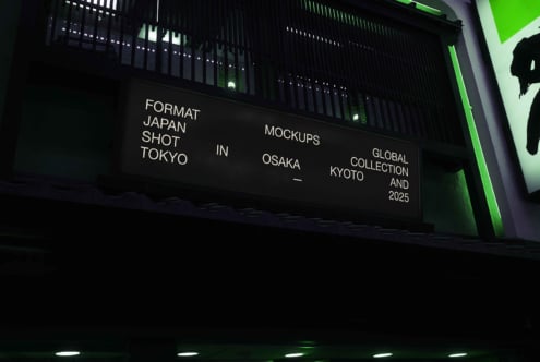 Horizontal backlit signage with thin sans serif text, bright green accent light, dark industrial backdrop