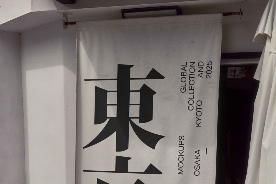 Hanging fabric banner mockup with bold black kanji design, Kyoto backdrop