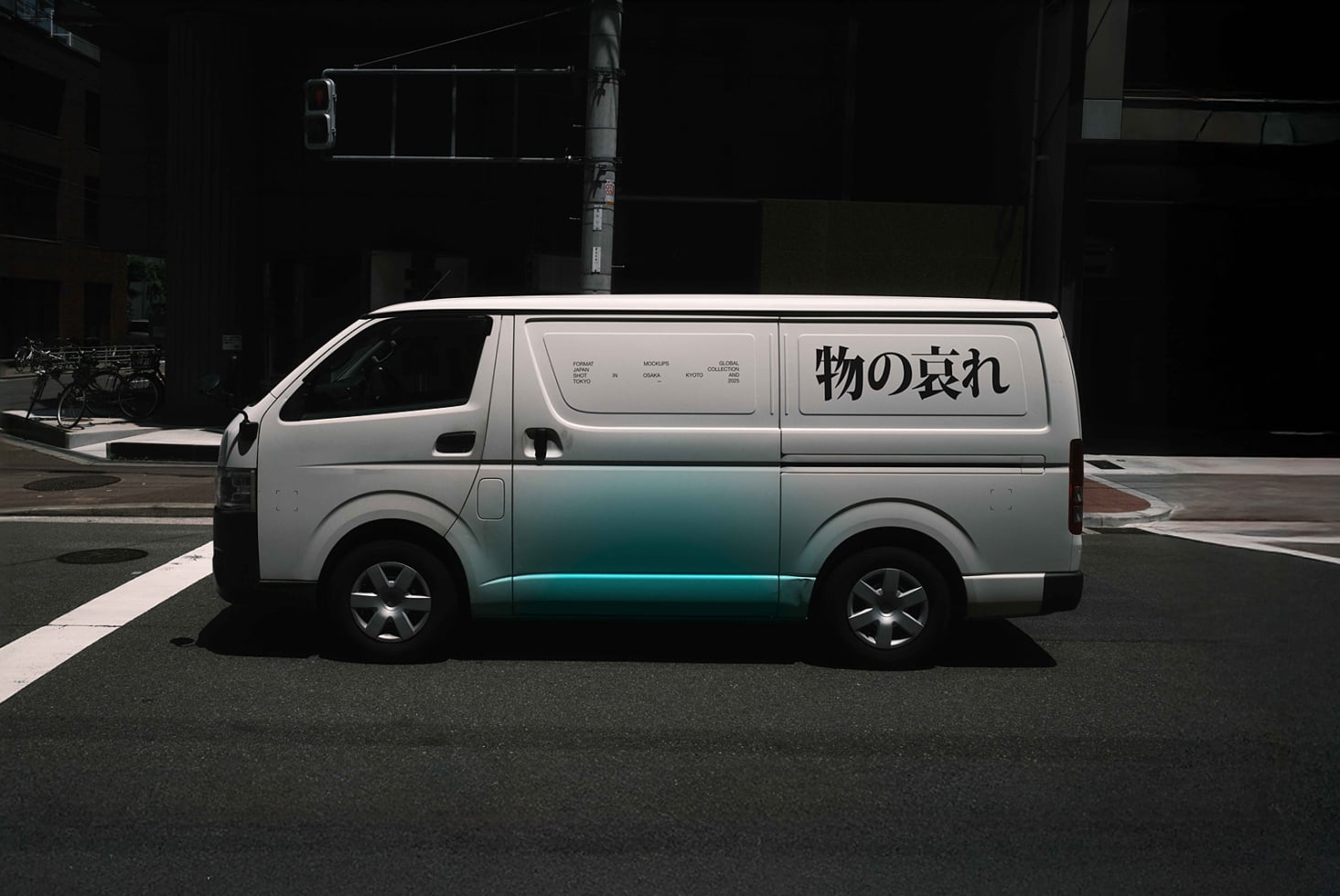 White van with teal gradient panel design parked on street