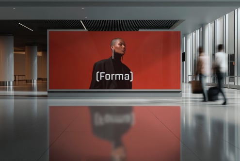 Gallery interior with red billboard featuring woman in black turtleneck (Forma) text