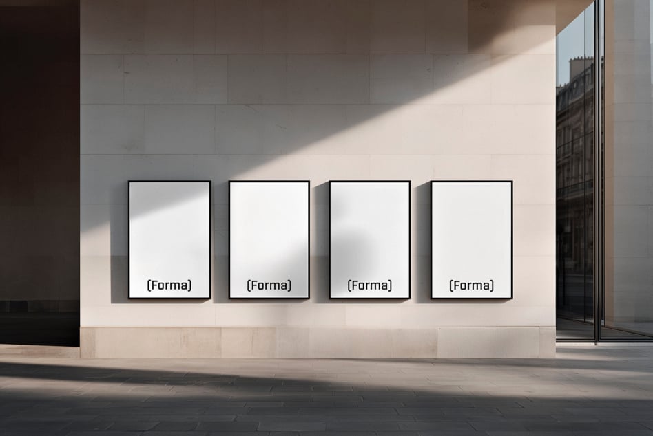 Four blank white frames hanging on minimalist gallery wall mockup