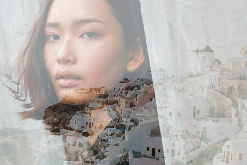 Woman's face merged with white Mediterranean buildings windmill architectural double exposure
