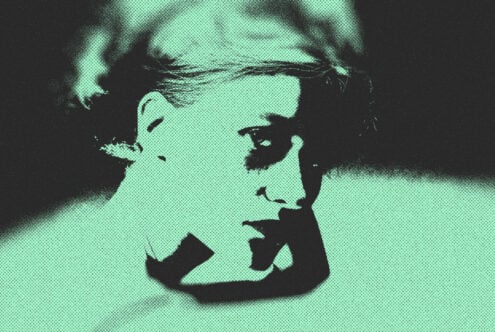 Mint green halftone portrait of person in profile with closed eyes