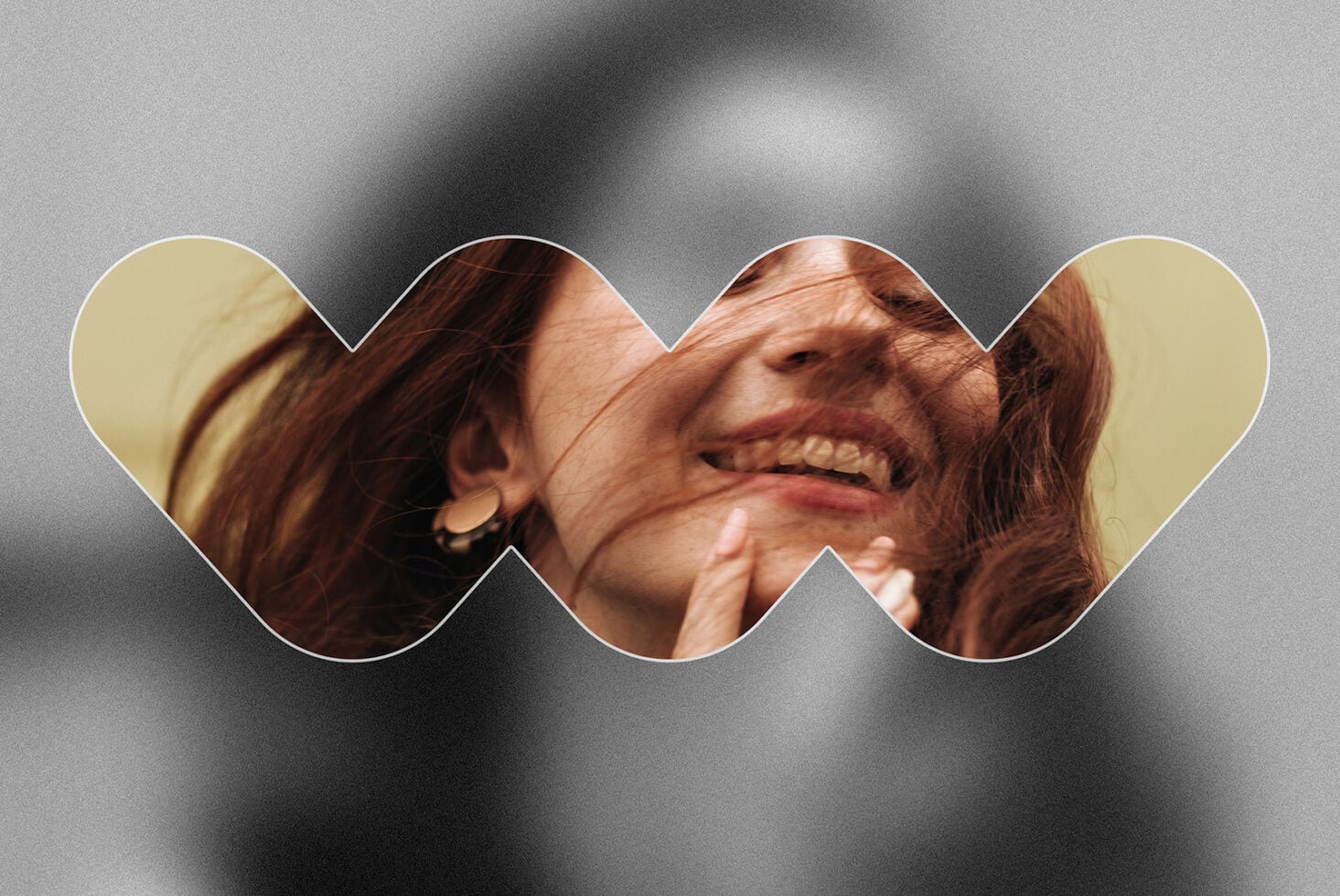 Woman laughing in curved wave frame on soft blurred grey