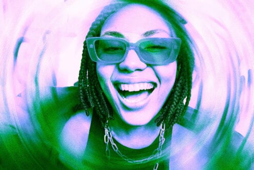 Person with braids wearing oversized sunglasses in neon pink cyan glitch effect