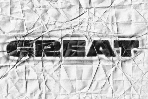 Crumpled paper texture overlay with black text effect