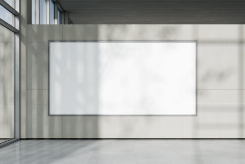 Large blank whiteboard mockup in modern office setting with natural light perfect for presenting design concepts or interior graphics.