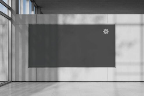 Wide billboard mockup on dark interior wall with metal frame detail
