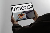 Tablet screen showing Inner.co website with flower photo layout