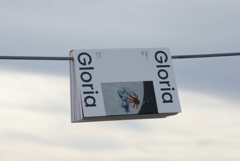 Folded brochure hanging on wire with colorful flower illustration mockup