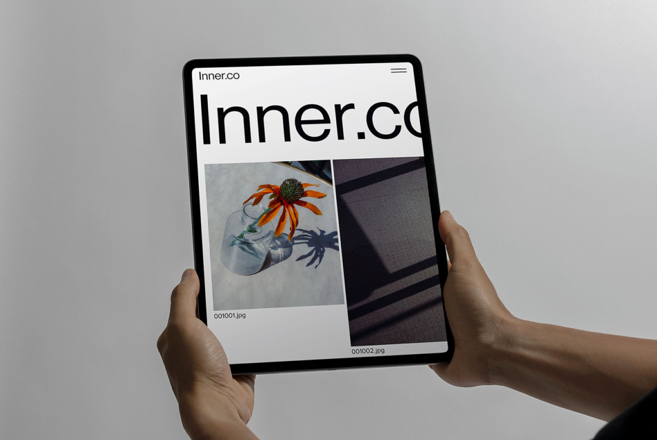 Tablet displaying Inner.co site with navigation header plus image gallery