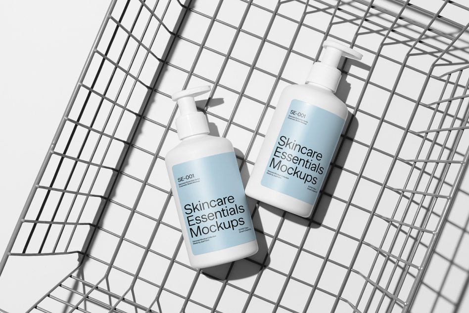 Pump bottles positioned on angled metal mesh surface with clean white backdrop