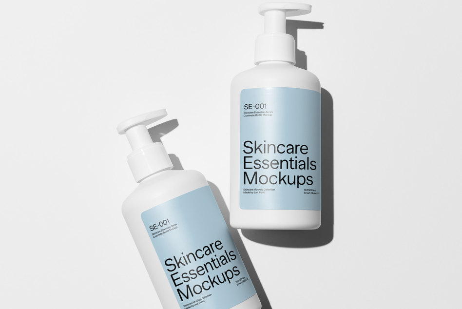Two white pump bottles with blue labels on neutral background with subtle shadows
