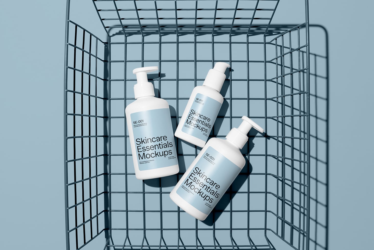 Three pump bottles inside shopping cart on blue background