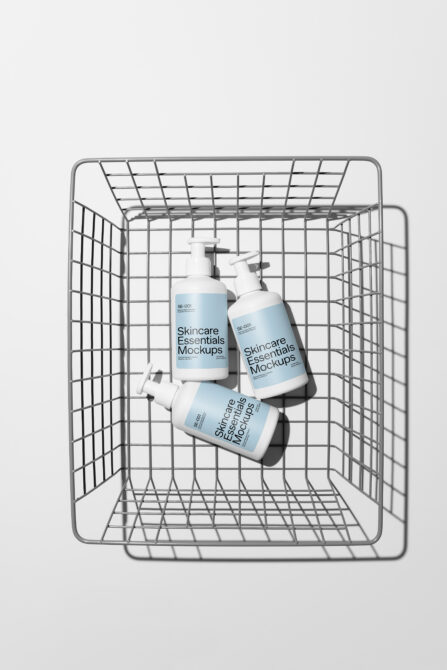 Skincare bottles with pump dispensers inside shopping cart mockup, overhead view
