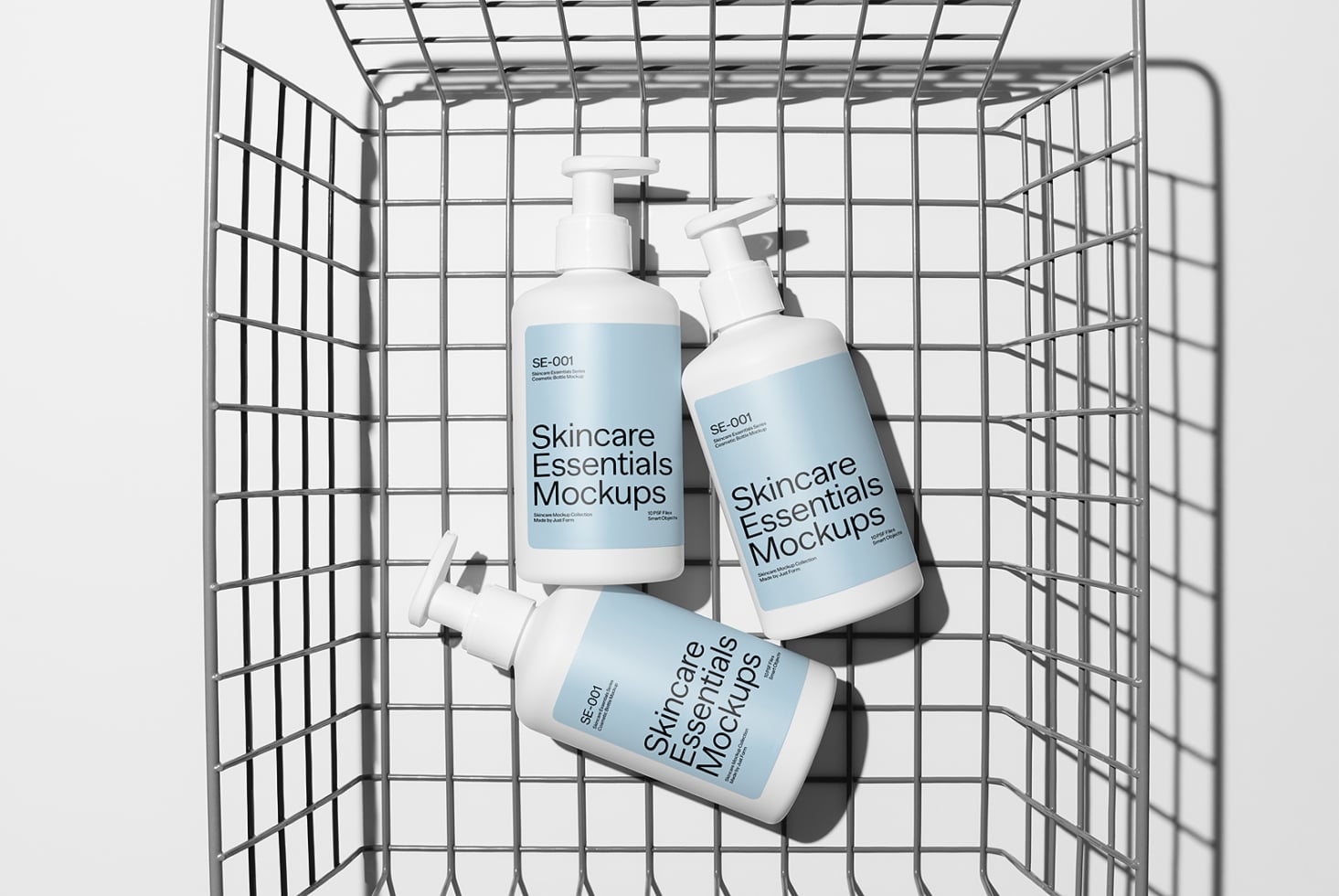 Three pump bottles inside wire shopping basket with clean minimalist labels