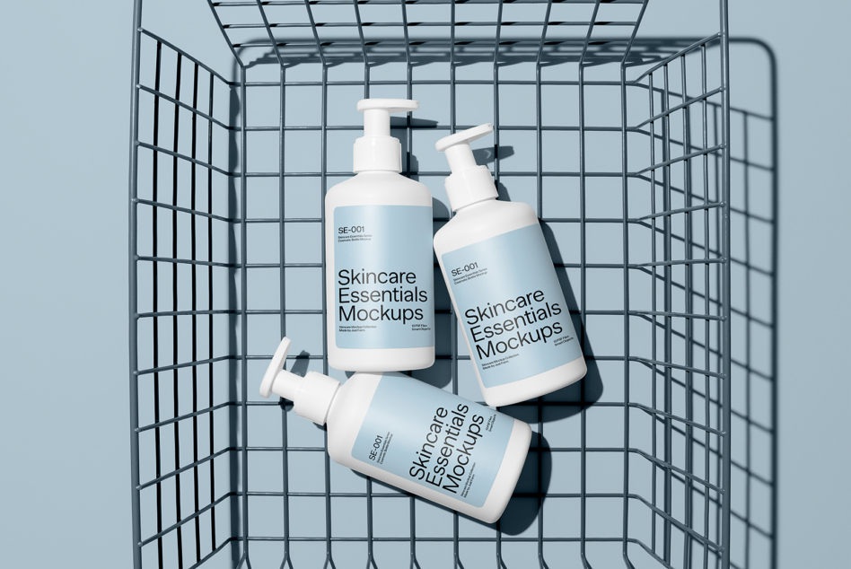 Skincare pump bottles arranged in a wire basket with clean shadows on pale blue background