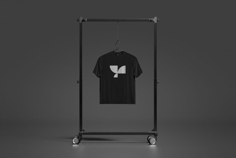 Black shirt with geometric logo on mobile display rack