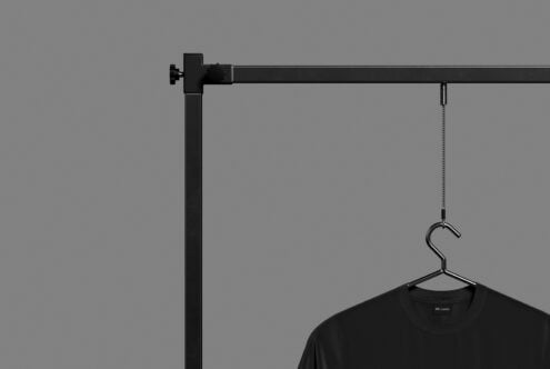 Clothing on overhead rod with hanging hook detail shot