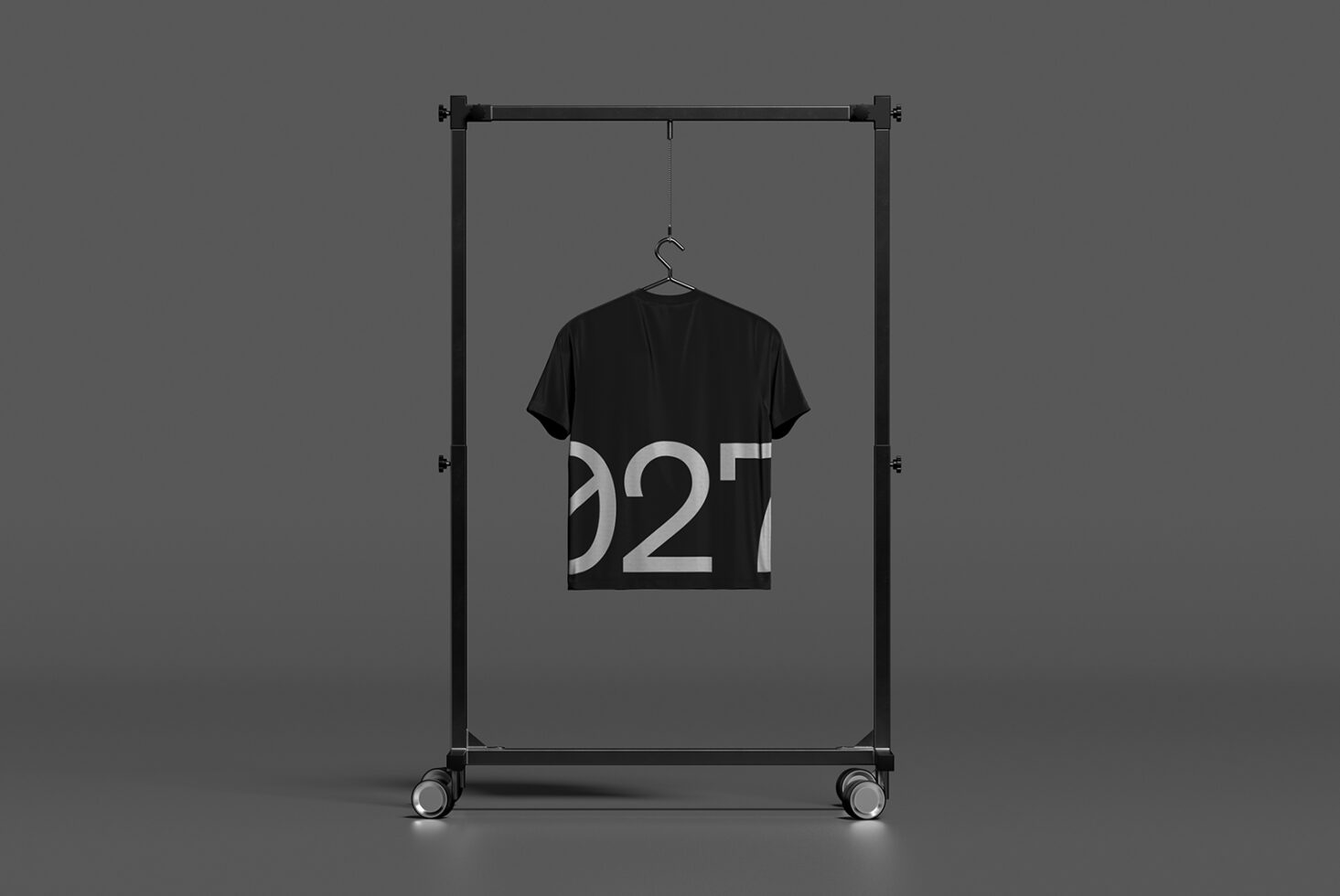 Black t-shirt on hanger inside clothing rack with numeric design on chest