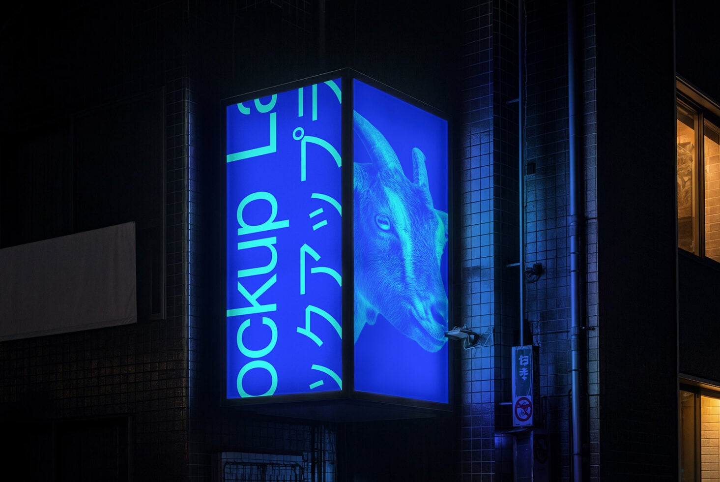 Glowing blue corner light box display with cyan typography at night on tiled building