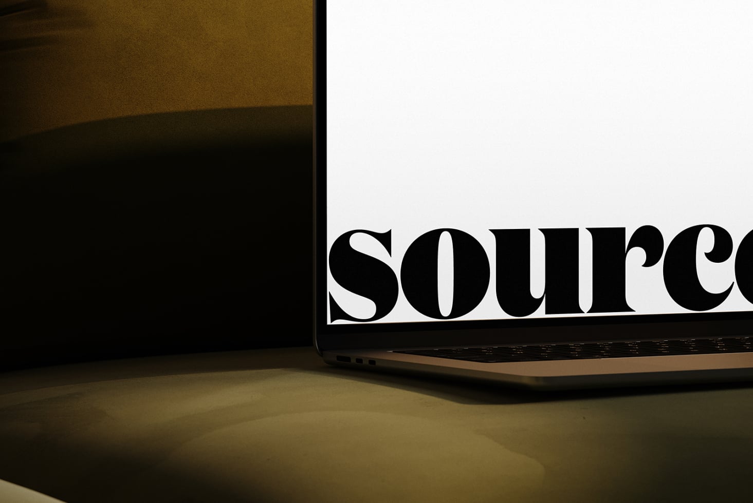Laptop screen displaying large serif type saying source in close-up