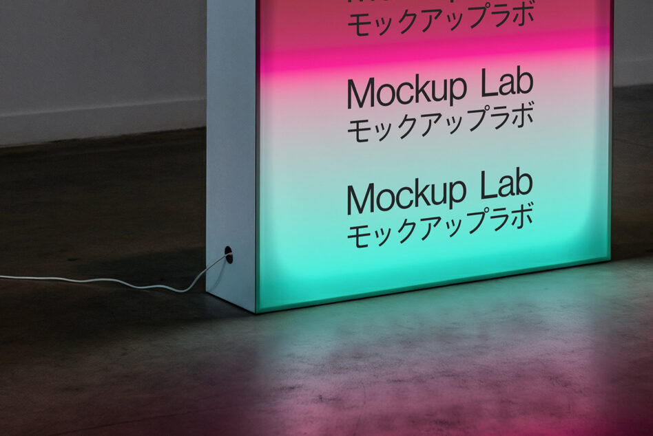 Illuminated lightbox with pink to cyan gradient glow in empty space