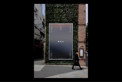 Outdoor advertising mockup on a green wall and brick building. Ideal for showcasing branding designs. Perfect for creative designers seeking urban mockups.