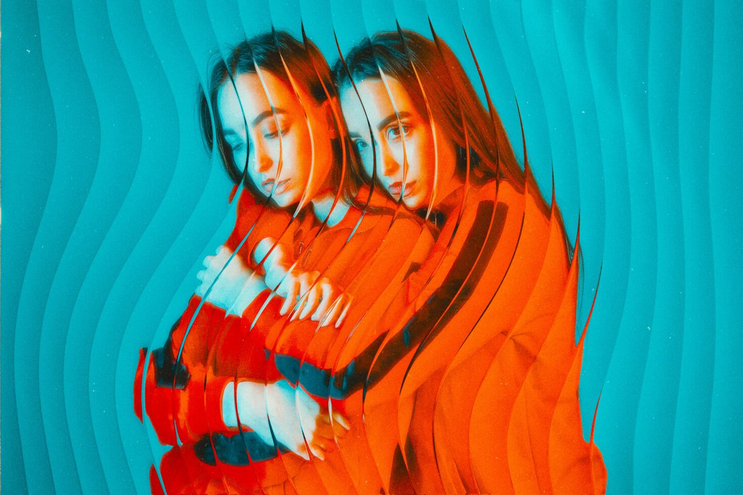 Doubled portrait with scan line displacement on turquoise background