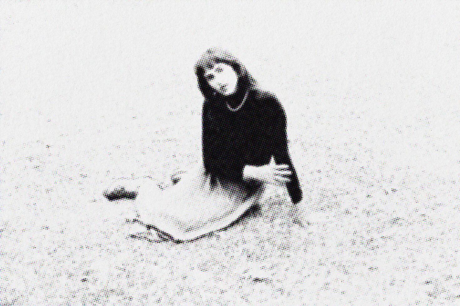 Person sitting on white textured background with halftone dot pattern effect