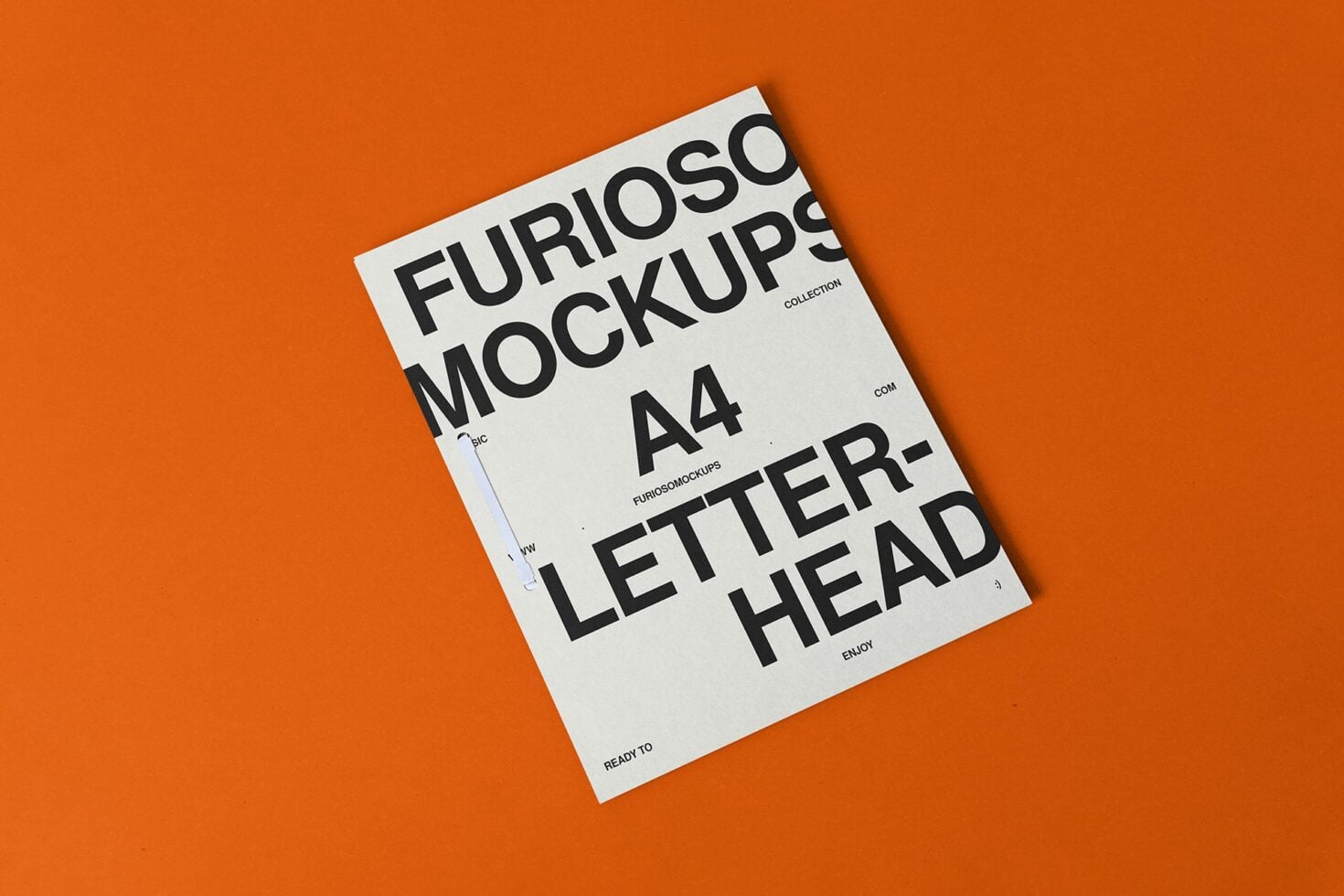 White A4 letterhead mockup tilted on bright orange surface