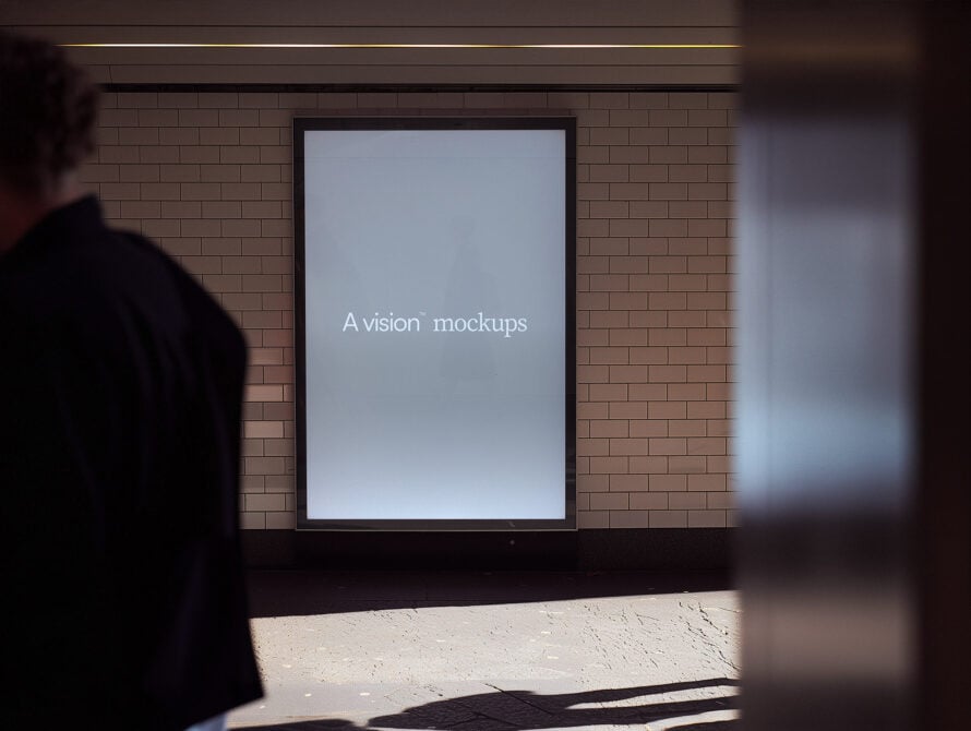 Light blue screen mockup on brick wall with A vision branding
