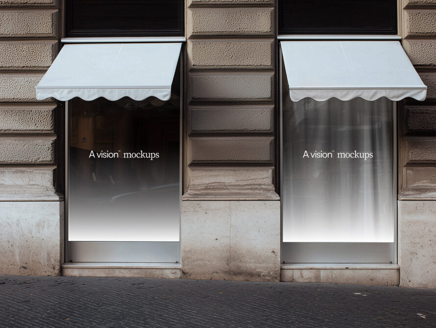 Light gray storefront awning mockup on textured stone building