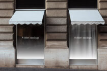 Pale blue awning mockup on stone building with people walking by