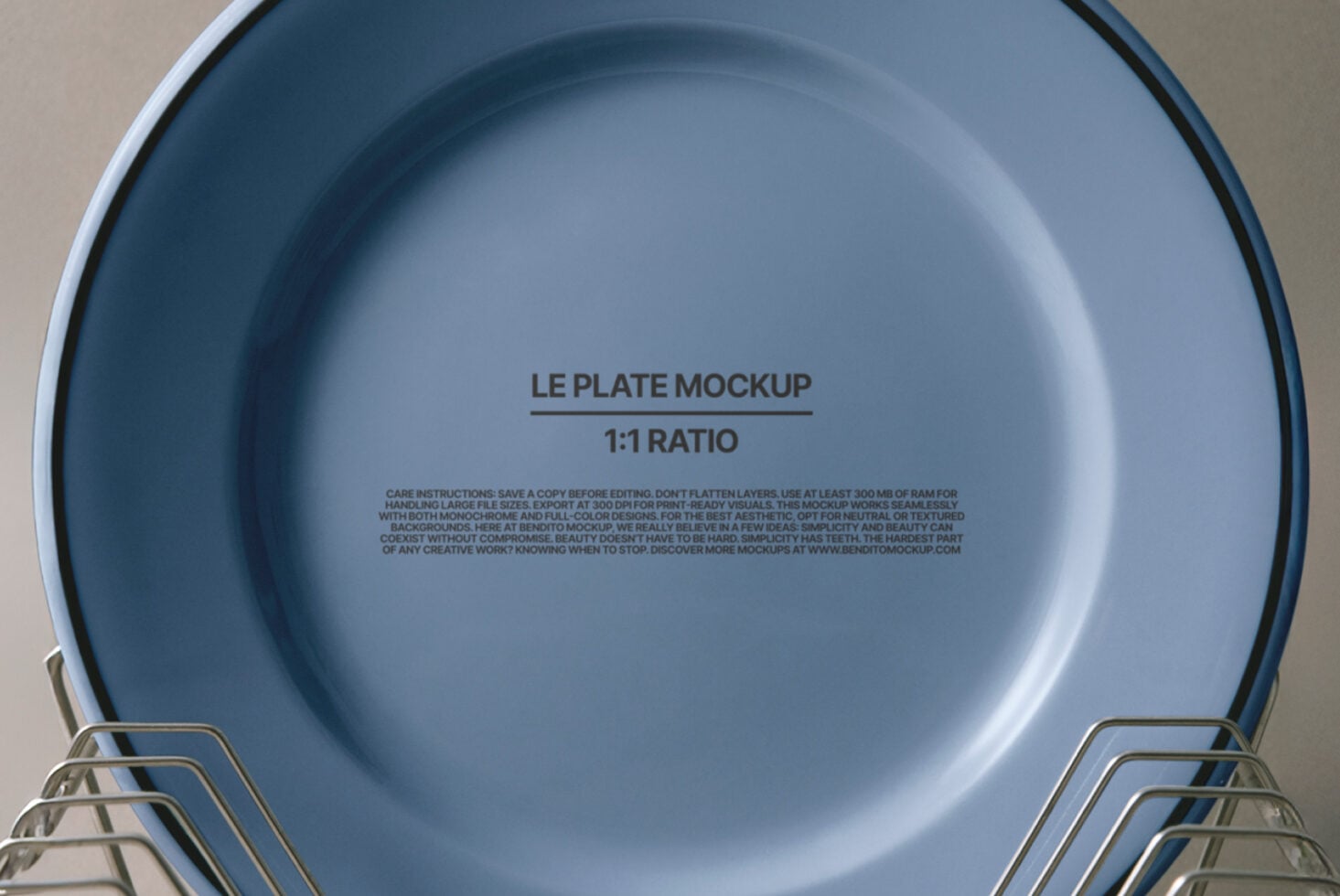 Blue dinner plate in tiered metal dish racks on neutral backdrop